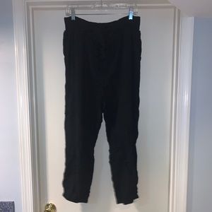 black pants tied with a bow